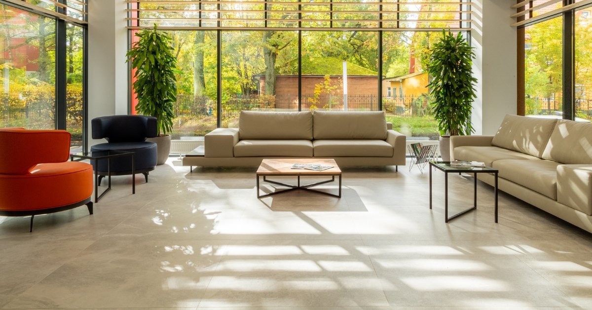 Spacious living room with large 600×1200 floor tiles and modern furniture, creating a seamless designer look in Adelaide home.